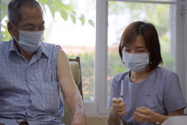 Nurse take medical exam for senior adult at home.